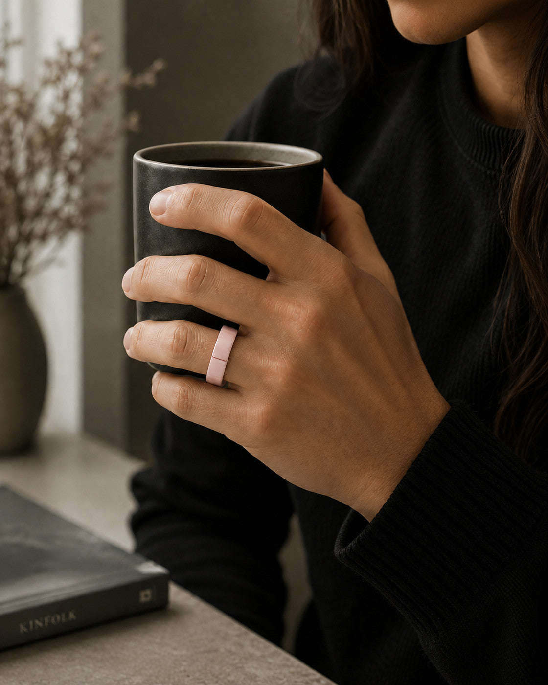 Kayza PRO pink smart ring worn while holding a coffee cup