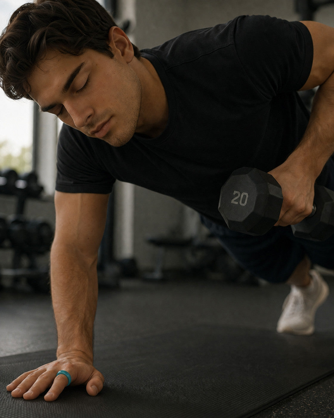 Kayza PRO teal smart ring worn during a gym training session